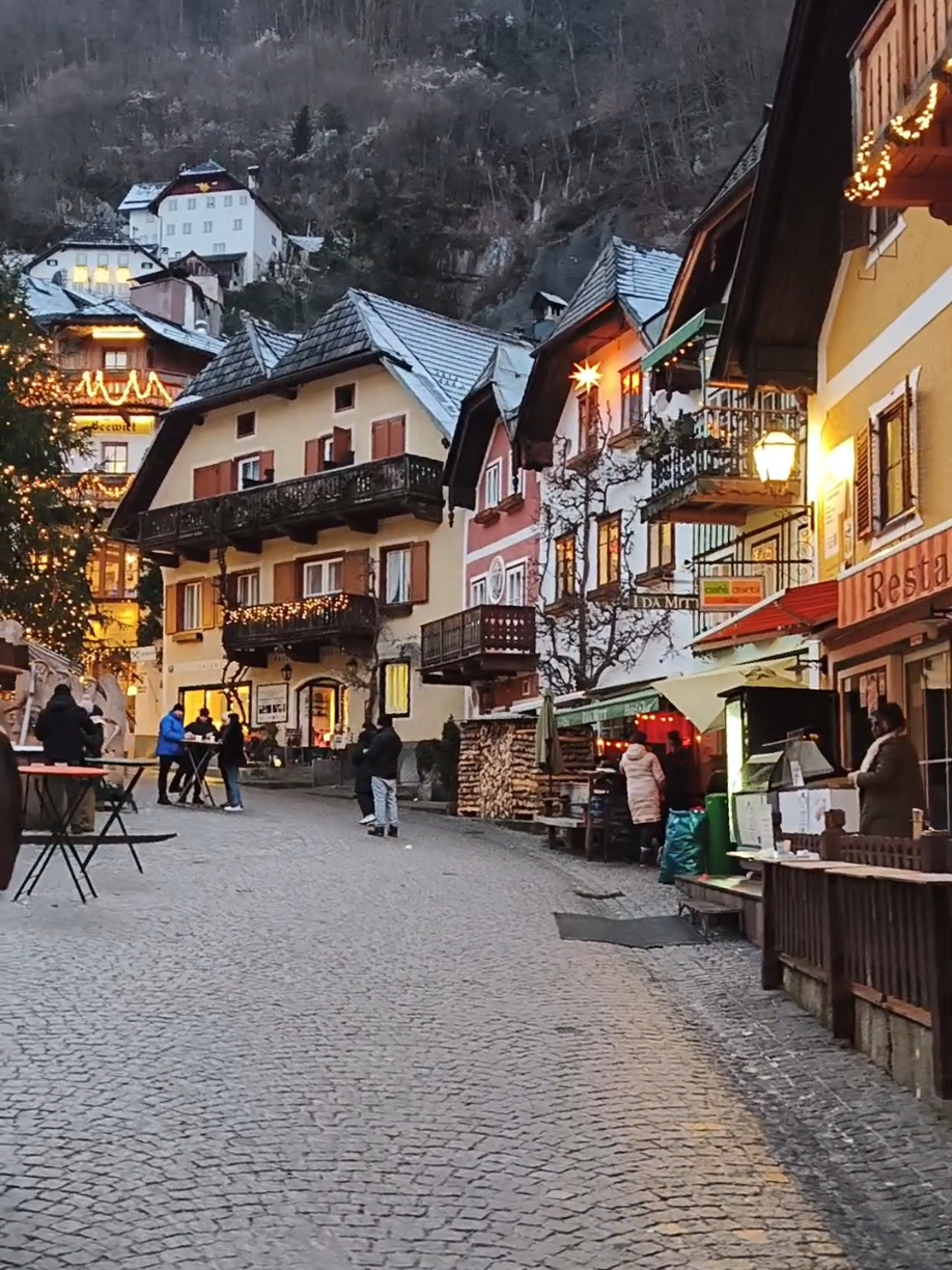 visiting Hallstatt in the winter after sunset, this old town of Hallstatt is the most beautiful in the world located in the heart of Austria stunning and beautiful with wonderful atmosphere 