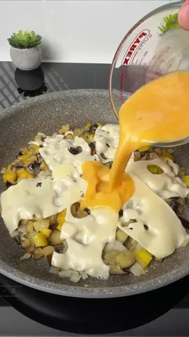 #VNVideoEditor                                      THIS EGGPLANT TORTILLA WILL BECOME YOUR NEW FAVORITE DINNER!                                                                            PERFECTLY MELTED CHEESY EGGPLANT TORTILLA BREAKFAST! INGREDIENTS: ● Eggplant — 1 medium ● Round Tortillas — 2 pcs. ● Eggs — 4 pcs. ● Cheddar or Radomer Cheese — 12 slices ● Onion — 1 medium ● Sweet Bell Pepper — ½ pc. ● Vegetable Oil — 3–4 tbsp. ● Salt — to taste INSTRUCTIONS: 1.Cut the eggplant into small cubes. 2.Heat the vegetable oil in a large skillet and add the eggplant. Season with salt and cook for about 7 minutes, stirring occasionally, until partially softened. 3.Add the diced onion and cook for 2–3 minutes. 4.Add the diced bell pepper and continue cooking for another 3–5 minutes. 5.Arrange 6 slices of cheddar (or Radomer) cheese over the vegetables. 6.Beat the eggs with a pinch of salt and pour them evenly over the cheese and vegetables. 7.Cover with a lid and cook until the eggs begin to set and the cheese starts melting. 8.Place one tortilla on top, gently press it down, then carefully flip everything over using a large plate so the tortilla is on the bottom. 9.Arrange the remaining 6 slices of cheese over the omelet. 10.Cover with the second tortilla, flip once more, and cook for another 1–2 minutes until the tortilla is lightly golden and crispy. 11.Transfer to a cutting board, slice into portions, and serve hot. ●Enjoy your meal● ●Save the recipe● ●It's incredibly delicious and very simple!!!● Bon appetit! The recipe in your language is available in the description, 💖🇺🇦🇵🇱🇩🇪🇺🇸🇫🇰🇪🇸🇵🇹🇮🇹🇷🇴 🇷🇸🇭🇷🇱🇻🇸🇮🇨🇿🇫🇮🇸🇪🇩🇰🇳🇴 🇯🇵 🇬🇷 🇮🇱🇰🇿🇰🇬🇱🇻🇹🇼 🇵🇪 🇦🇷 🇨🇱 🇻🇪 🇹🇭 🇧🇷 🇩🇿      #EggplantRecipe #TortillaRecipe #EasyBreakfast #simplydeliciousrecipes 