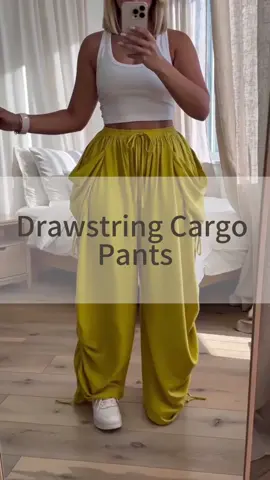 #GoldenFlowPants 💛🌿 Bright wide-leg pants with an easy vacation feel. The drawstring waist, roomy pockets, relaxed drape, and side ruched details make them perfect for beach days, travel outfits, resort walks, or laid-back weekend plans. Bold, comfy, and made to stand out. #WideLegPants #YellowPants #VacationStyle #TravelOutfit      
