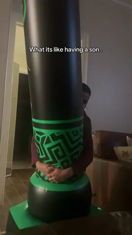 His new punching bag, he has been bringing it up and down the stairs the past two days and practicing bon stop. #BoyMom 
