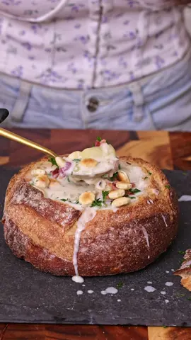 New England Clam Chowder (Fresh + Canned Clams) Ingredients (6–8 servings) * 4 oz (115 g) bacon, diced * 2 tbsp unsalted butter * 1 medium yellow onion, finely diced * 2 celery stalks, diced * 2 cloves garlic, minced * 3 tbsp all-purpose flour * 1 lb (450 g) fresh littleneck or cherrystone clams (about 10–12 clams) * 2 (6.5 oz / 184 g) cans chopped clams, drained (reserve all the juice) * 2 cups clam juice total     * Reserved juice from canned clams     * Plus cooking liquid from the fresh clams     * Top up with bottled clam juice if needed * 2 cups whole milk * 1 cup heavy cream * 2 large russet potatoes (about 1 lb / 450 g), peeled and ½-inch diced * 1 bay leaf * ½ tsp dried thyme * ½ tsp kosher salt (adjust at the end) * ½ tsp freshly ground black pepper * 1 tbsp fresh parsley, chopped For serving: * Bread bowls or/with oyster crackers * Extra crispy bacon * Chopped parsley Instructions 1. Steam the fresh clams Place fresh clams in a pot with ½ cup water. Cover and steam for 6–8 minutes, just until they open. Remove the clams. Strain the cooking liquid through a fine sieve or cheesecloth to remove any sand. When cool enough to handle: * Remove the meat. * Roughly chop it. * Reserve. Combine this cooking liquid with the canned clam juice until you have 2 cups total. 2. Cook the bacon Cook bacon in a Dutch oven until crispy. Transfer bacon to a paper towel. Leave about 2 tablespoons bacon fat in the pot. 3. Cook the vegetables Add butter. Cook onion and celery for about 5 minutes. Add garlic and cook another 30 seconds. 4. Make the roux Sprinkle in flour. Cook while stirring for about 2 minutes. 5. Build the chowder Slowly whisk in the 2 cups clam juice. Add: * milk * heavy cream * potatoes * bay leaf * thyme Bring to a gentle simmer. Cook 15–18 minutes, until potatoes are tender. For a thicker chowder, lightly mash about ¼ of the potatoes against the side of the pot. I also added all the juice from canned clams, because I like my chowder on the thinner side. 6. Add the clams Stir in: * chopped fresh clams * canned chopped clams Heat gently for 3–5 minutes. Do not boil after adding the clams or they will become tough. Season with salt and pepper. 7. Serve