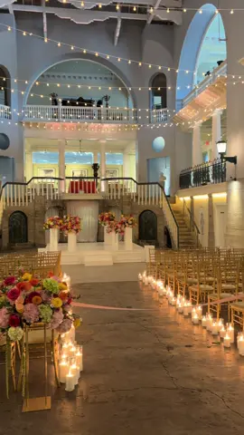 Zoie and Lawson weren't afraid to have a little fun with their wedding design. 🌼  Orange, pink, yellow, and green florals filled the room, while colorful candles, orange-and-white linens, and a disco ball brought in the perfect amount of retro 70s energy. 🪩  Zoie + Lawson, 8.7.2026 @zoie.kaitlyn @lawsmith1  Venue: @lightnermuseumevents  Getting Ready Suite: @theplazasuitesta  Planners: @uncorkedoccasions  Caterers: @legacycateringstaug  Florist: @thebluetulipflorals  Bakery: @sweetweddingscakedesigns  Photographer: @carolinepiercephotography  Rentals: @stjohnsilluminations  Entertainment: @coscelebrations  Hair: @lindseysouthwell_xo  Makeup: @makeupbychristinaburns  Photo Booth: @capturewithstyle_booth #staugustineweddings #lightnermuseumweddings #floridaweddingvenue #historicvenue #brightflorals 