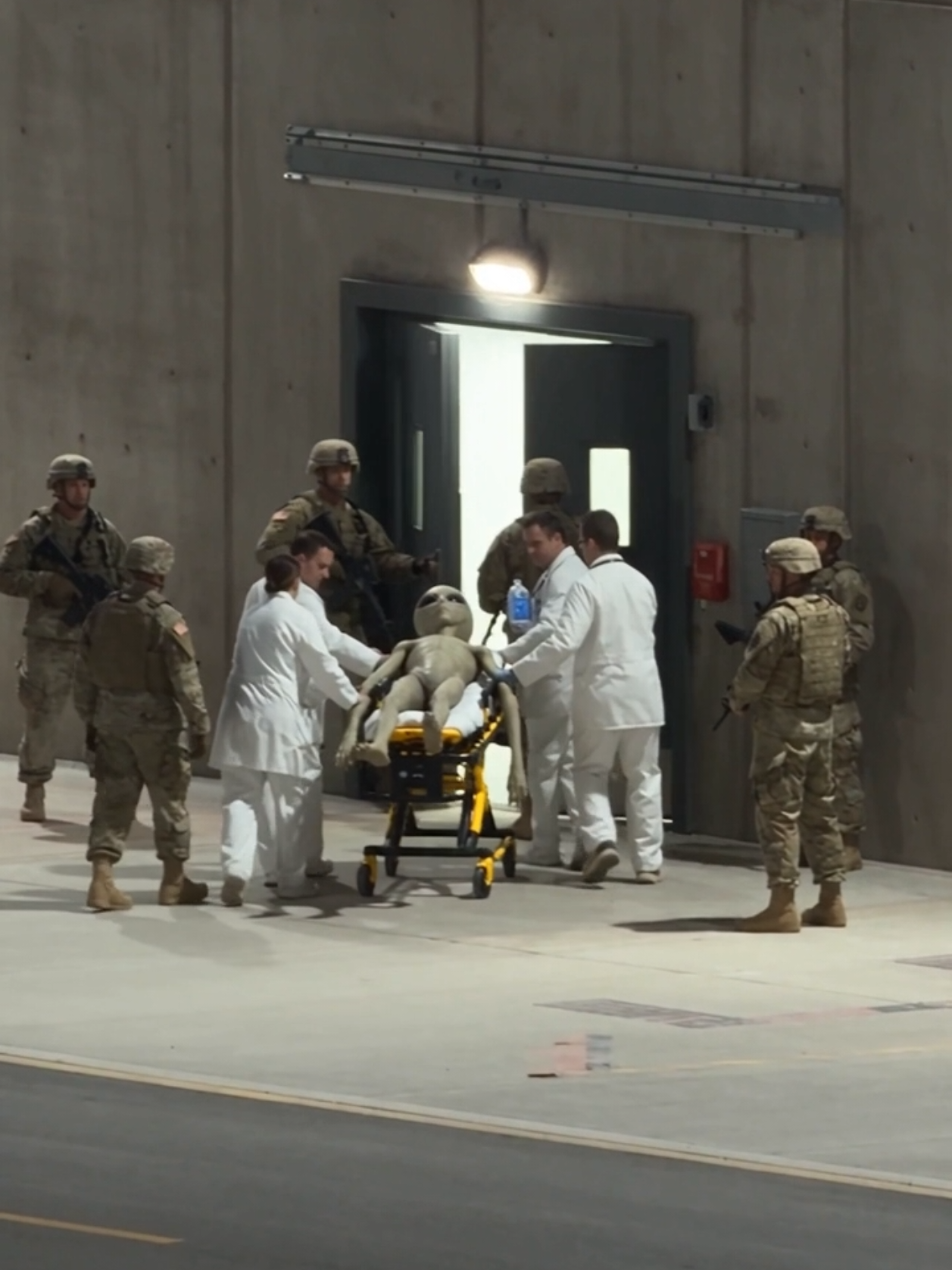 Area 51 Alien Transport Caught on Camera at Night 👽🔒 A camera zooms into a restricted desert facility and captures doctors and military personnel moving an unconscious alien toward a secured research building. #Area51 #Alien #UFO #Extraterrestrial #foundfootage 