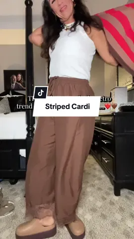 This striped cardigan is giving me all the retro fall vibes without looking dated. The brown and coral stripes, oversized sleeves, and relaxed open-front fit make it one of those pieces you can throw over a basic tank and instantly look put together. Perfect for those early fall days when you want cozy without wearing a heavy sweater. #GenXFashion #WomenOver40Style #FallFashion #CardiganSeason @Yeokou 