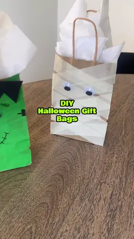 DIY Frankenstein & Mummy Gift Bags using tape! Save this fun idea to make your own! Follow for more fun crafts and activities!  Inspo @hellominibianco  #halloween #halloweencrafts #crafts #halloweencraft #diycrafts 