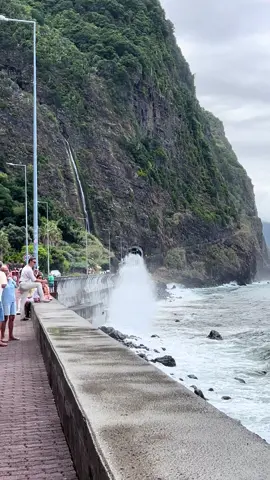 One of Madeira’s most unforgettable spots 🌊⛰️ A dramatic waterfall pouring down the mountain, a tunnel carved through the cliffs, and the wild Atlantic crashing against the shore right beside it. 🌴🌊 And those waves? They can surprise you! 😳 #Madeira #MadeiraIsland #PortugalTravel #RibeiraDaAguaDAlto #traveltiktok 
