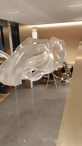 The ribbon-shaped lights in the lobby of the sales office.