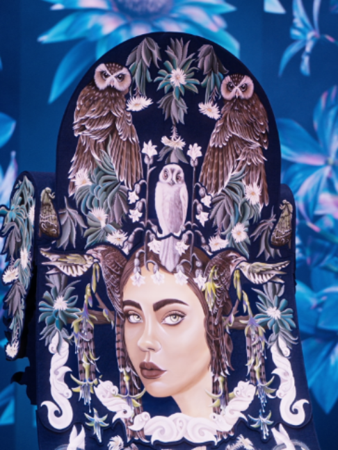 Introducing the 2026 Supreme WOW Award winner Sacred Nightfall by Kayla Christensen from New Zealand. An intricately hand-painted and stitched tapestry which summons an ethereal night goddess from the deep native forests of Aotearoa, the judges described it as mesmerising and multilayered, rich with kaitiakitanga (guardianship) and wairua (soul). “Sacred Nightfall asks us to listen to what remains in the darkness and protect what still lives. The extinct whēkau and ruru hinapō are painted back into existence, restoring their memory and honouring the fragile natural world that still surrounds us”. Garment Credit: Sacred Nightfall, Kayla Christensen, New Zealand #worldofwearableart #wearableart #2026SupremeWOWAward
