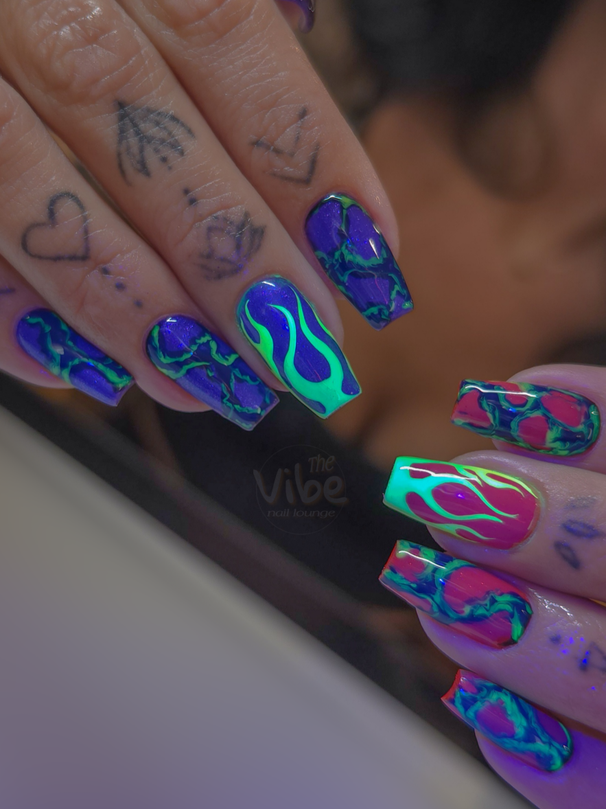 the vibe was ~ 𝖘𝖎𝖈𝖐 𝖋𝖎𝖗𝖊 💜🔥💚 Inspired by the photos attached, for her HHN trip ⚡ . HARD GEL FILL W SHORTENING ON MEDIUM LENGTH . DRY MANICURE PREP . FULL CUSTOMIZED HAND PAINTED ART INCLUDING PIGMENTS . 2 HRS 5 MINS START TO FINISH (art approx 25-35 mins) ⚡ #flamenails #blacklightnails #HHN35 #halloweennails #thevibenaillounge 
