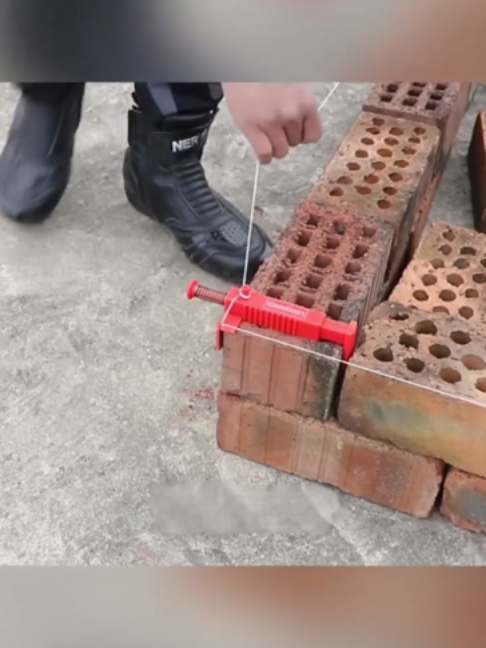 Laying bricks with a guide line; ensuring perfect horizontal and vertical alignment #ConstructionSiteTips #MasonryDaily #BricklayingSkills #HomeConstruction #Renovation
