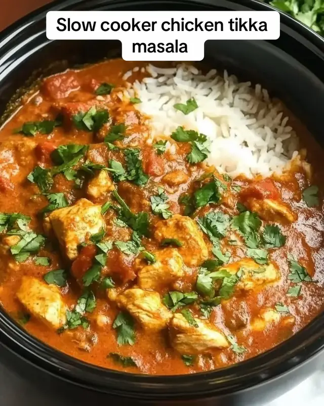 Creamy Slow-Cooked Chicken Tikka Masala with Fragrant Indian Spices Recipe Ingredients: 2 lbs (900 g) boneless, skinless chicken thighs 1 large onion, finely chopped 4 cloves garlic, minced 1 tablespoon fresh ginger, grated 1 can (400 g) crushed tomatoes 1 can (400 ml) full-fat coconut milk ½ cup plain Greek yogurt 2 tablespoons tomato paste 2 tablespoons garam masala 1 teaspoon ground cumin 1 teaspoon ground coriander 1 teaspoon paprika ½ teaspoon turmeric ½ teaspoon chili powder, or to taste 1 teaspoon salt ½ teaspoon black pepper 2 tablespoons butter 1 tablespoon olive oil ½ cup chicken stock 1 teaspoon brown sugar, optional Fresh coriander, chopped, for garnish Cooked basmati rice, for serving Warm naan bread, for serving Directions: Prepare the chicken by trimming any excess fat. Cut the chicken thighs into large bite-sized pieces and place them in the slow cooker. Add the chopped onion, minced garlic, grated ginger, crushed tomatoes, tomato paste, garam masala, cumin, coriander, paprika, turmeric, chili powder, salt, and black pepper. Pour in the chicken stock and stir everything together until the chicken is evenly coated with the spices and tomato mixture. Cover the slow cooker and cook on LOW for 5–6 hours or HIGH for 3–4 hours, until the chicken is tender and cooked through. About 20–30 minutes before serving, stir in the coconut milk and butter. Cover again and allow the sauce to become creamy and fragrant. In a small bowl, whisk the Greek yogurt until smooth. Add a few spoonfuls of the hot curry sauce to the yogurt and stir to gently warm it. This helps prevent curdling. Stir the tempered yogurt into the slow cooker. Add the brown sugar if desired, then taste and adjust the seasoning. Let the curry cook for another 10–15 minutes on LOW. If the sauce is too thin, leave the lid slightly ajar and cook for another 15–20 minutes. If it is too thick, add a splash of chicken stock or coconut milk. Serve the creamy chicken tikka masala over fluffy basmati rice, with warm naan bread on the side. Garnish generously with freshly chopped coriander. Serve hot and enjoy this easy, comforting slow-cooked Indian-inspired dinner. Prep Time: 15 minutes | Cooking Time: 5 hours 30 minutes | Total Time: 5 hours 45 minutes Kcal: 485 kcal | Servings: 6 servings #followformore #Foodie #tastyfood #chickenrecipes #recipes 