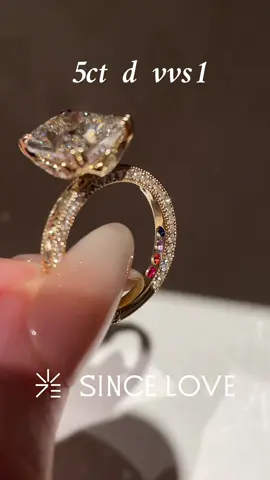 A dream bridal set, made personal. 💍✨ Custom-created for our client, this 5ct D-color, VVS1 cushion-cut ring pairs beautifully with a matching contoured diamond band. Intricate hand engraving, pavé diamonds on both sides, and four birthstones tucked inside the band—personal details that make this set truly theirs. 🤍 Message @WA+1(307)2638735 to create a ring that tells your story. #CushionCutRing #CustomBridalSet #HandEngravedRing #BirthstoneRing #SinceLoveJewelry