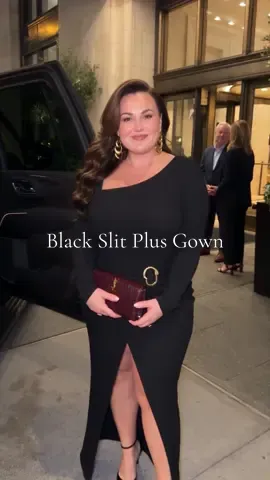 Plus size long sleeve black gown, elegant side slit for formal events. #plussizedress #formalgown #slitdress #curvyfashion #partydress