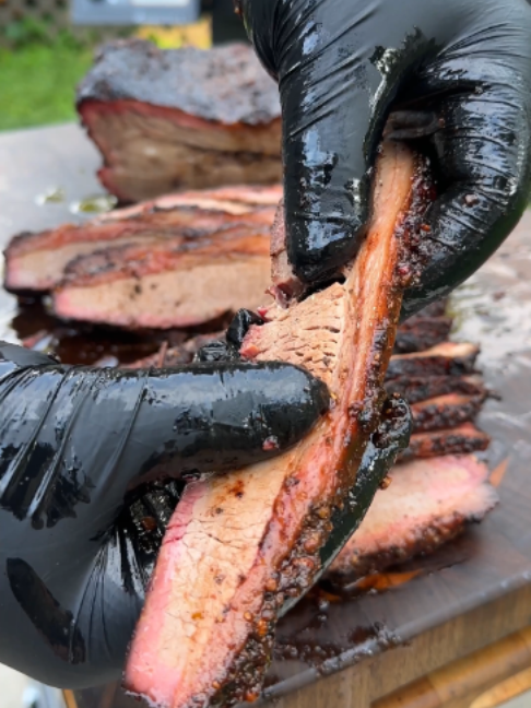 Foil Boat Brisket Method Recipe 👇 Recipe: Servings: 6-8 People Prep: 60 minutes Cook: 10-14 hours Ingredients: 1 Whole Packer Brisket, 13-15 lbs 2 cups Mesquite Peppercorn Lager Rub 1.5 cups Imperial Coffee Stout Rub 1 cup Beef Tallow, warmed up Instructions: Keeping your brisket cold, place the brisket on your cutting board fat cap side down. Next, trim the outside of the flat of any silver skin or pockets of fat. Remove the larger pocket of fat near where the flat and point meet. Square off all sides of your brisket then cut one of the corners on the point to show you how to cut against the grain later. Flip the brisket over and begin carefully removing fat from the fat cap. Make sure the fat cap side is about ¼ inch thick as anymore will be too much. Finally, remove most of the fat “flap” at the top of the brisket. Once completely trimmed, season thoroughly with my Mesquite Peppercorn Lager Rub and Imperial Coffee Stout Rub (or your favorite beef rub). Place your brisket into the fridge to dry brine overnight.. Preheat your smoker for 225-250F with some added wood chunks or chips for extra smoke flavor. Add the brisket on to the smoker fat side up. Cook the brisket until it reaches about 165-170F at the thickest and fattiest part (about 7-8 hours). Once it has hit 165, get ready for the foil boat. Lay out 1-2 pieces of foil and add beef tallow to the foil. Place the brisket (fat side up) on top of the beef tallow then form the foil around the brisket to make a “boat”. Place the brisket back onto the smoker at 250F. Cook until the meat hits 201F internal or is probe tender (about 5-6 more hours). Once it is done, pull the meat off and let it rest at room temperature for at least 2 hours but ideally overnight in a warming tray. When it is ready to slice, unwrap and place the butcher paper to the side (save for serving or for burnt ends). Begin slicing the brisket right where you made your “against the grain” cut when prepping. Make your slices about the width of a #2 Pencil. If slicing the point: Rotate the point 90 degrees and then slice in order to go against the grain. When you are done, serve and enjoy with smoked brisket!