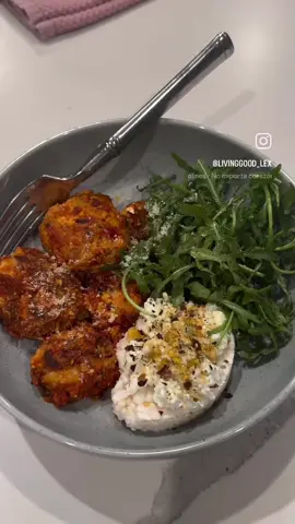HIGH-PROTEIN CHICKEN MEATBALLS 🍅 (doubled the meat for leftovers, & enough to throw in those morning scrambles)! This recipe makes about 24 meatballs.   2 packs lean ground chicken (I doubled the meat for a larger batch) * 2 eggs * ½ cup Nancy’s cottage cheese (adds 14g protein) * ½ cup Aleia GFAvocado Oil Panko Bread Crumbs  * 3 tbsp grated Parmesan * Handful of arugula, finely chopped (amazing flavor) * Minced garlic * Fresh oregano * Parsley * Garlic powder * Red pepper flakes * Black pepper * 1 jar @Rao’s Homemade Sensitive Marinara Sauce I prepped in the morning and scooped and pan fried at night in @Chosen Foods avocado oil spray & once cooked. I let them all simmer in the sauce for around 30 minutes. The leftovers are great!! & THIS IS SOOO COZY & serve with some arugula with lemon salt pepper #wellness #EasyRecipes #cleaneating #livinggoodlex #highprotein 