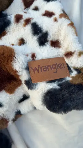 This Wrangler cow print throw is velvet soft, amazing quality, and SO affordable! #Wrangler #cowprint #WesternDecor #CozyHome