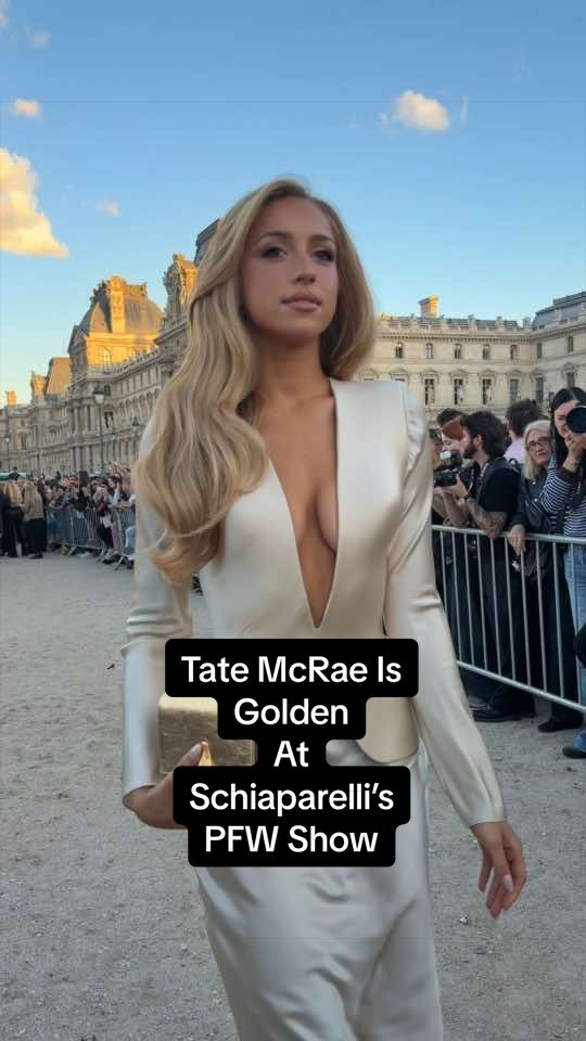 Just keep watching—a golden #TateMcRae arrives at @schiaparelli’s spring/summer 2027 #ParisFashionWeek show.