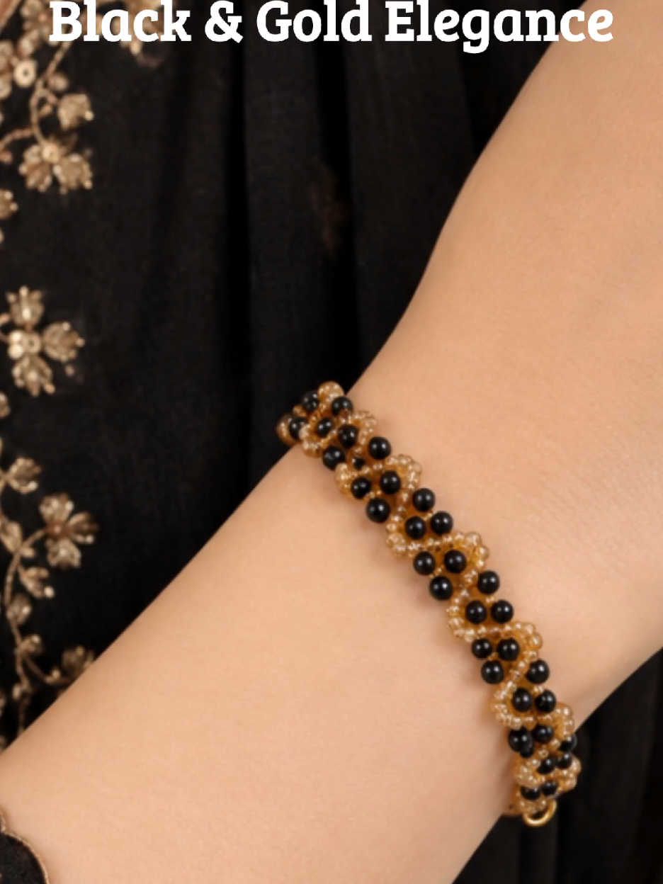 Elegant & Stylish ‎This beautiful handmade black & golden beaded bracelet is perfect for casual wear, parties, gifting, and special occasions. ‎Customization is also available.WhatsApp to order yours. #HandmadeBracelet #BeadedBracelet #BlackAndGold #BlackGoldBracelet #CrystalBracelet  ‎ ‎