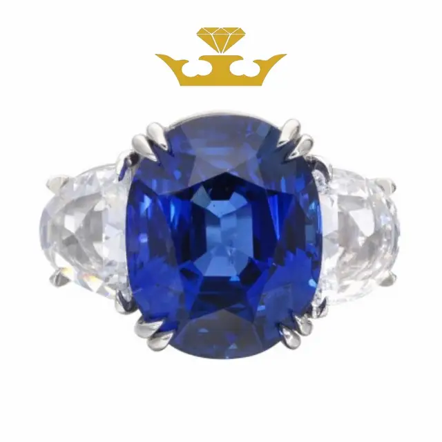 A royal blue sapphire that commands attention. 💙👑 Surrounded by dazzling diamonds, this timeless three-stone masterpiece is elegance at its finest. #JewelersTruly #BlueSapphire #SapphireRing #HighJewelry #FineJewelry   