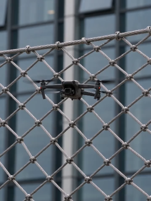 Stainless steel rope mesh for drone protection, safety barriers and special security applications. Strong, durable and designed for customized protection solutions.#DroneProtection #AntiDrone #DroneNet #SecurityNet #StainlessSteelMesh #RopeMesh #WireRopeMesh #MetalMesh #SafetyNet #SecurityFence #IndustrialSecurity #PerimeterSecurity #Engineering #Construction #CustomSolution