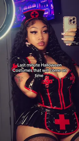 LAST MINUTE COSTUME IDEAS! FAST this halloween, i’m clocking in for the night shift 🖤❤️🩺 this black and red nurse costume from dolls kill is giving dark, edgy, and straight up halloween baddie! the glossy corset, red cross details, matching skirt, gloves, and nurse hat make the whole look stand out. definitely one for the girls who love a bold costume! 🩸 #dollskill #halloweencostume #nursecostume #halloweeninspo #halloweenglam   