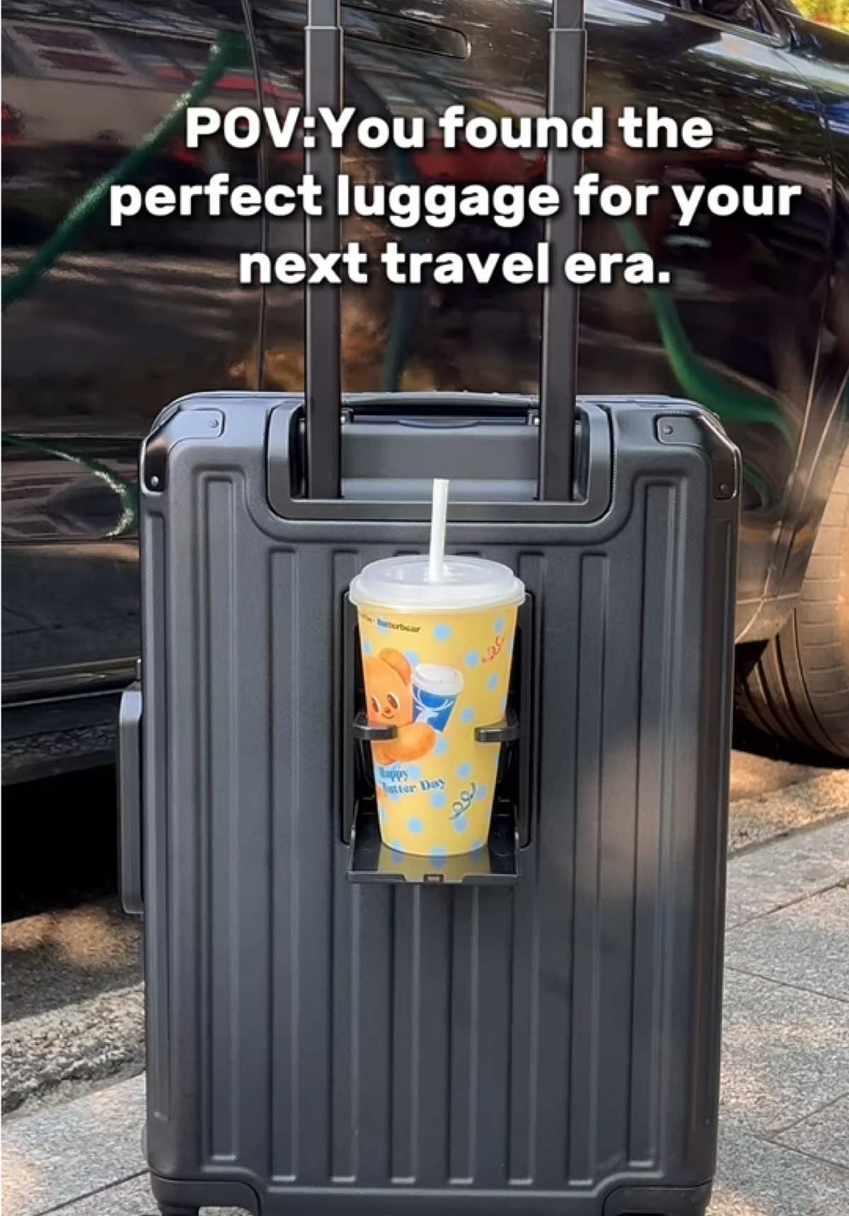 Wait til you see the cup holder pop out☕️one tap and your coffee has a home.#luggagecupholder #tsalock #zipperlessluggage #rimowa #creatorsearchinsights 