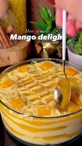 Mango Delight Ingredients * 4 cups mango puree * 1 & ½ cups cream * ½ cup condensed milk * Marie biscuits: As needed for layering * Mangoes (chunks): 2 cups Instructions 1. Add the 4 cups of mangoes into a blender and blend to make a smooth puree. 2. Add 2 cups of the mango puree, 1 & ½ cups of cream, and ½ cup of condensed milk into the blender. Blend everything together for a minute. 3. Set the remaining 2 cups of mango puree aside. 4. Layer Marie biscuits in the bottom of a dish or bowl. 5. Add a layer of the blended cream and mango mixture over the biscuits. 6. Add a layer of the plain mango puree that you set aside. 7. Spread some mango cubes (chunks) over the top. 8. Repeat these layers as many times as you like. 9. Refrigerate overnight and serve cold! [ asmr, mango delight, desserts, recipe, no bake dessert, ] #asmr #mangodelight #Recipe #nobakedessert