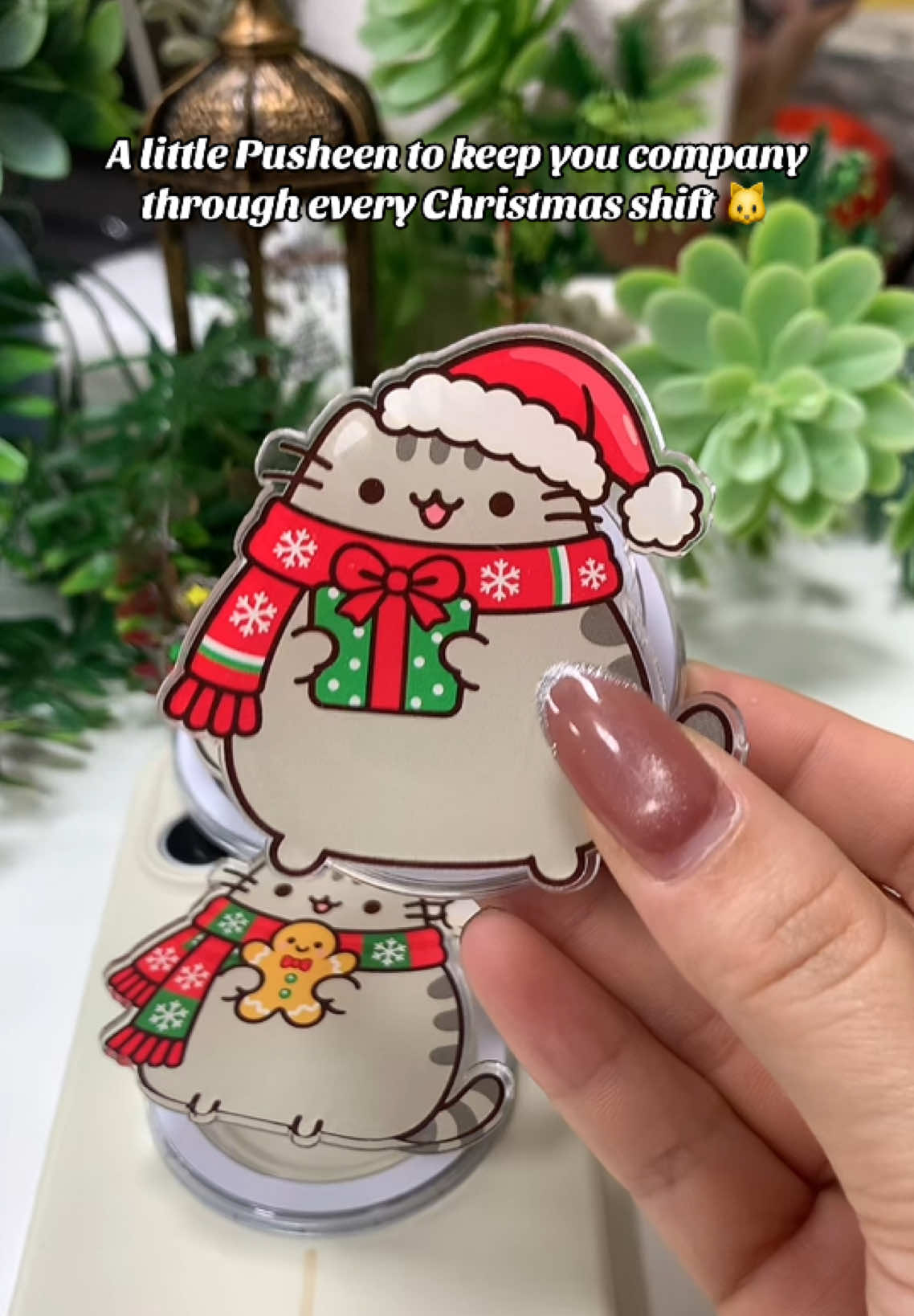 Chubby cat, festive vibes, and a badge reel that makes your scrubs extra cute 🎅😭😄🎄🌲🎅🤶🧑‍🎄#phonegrip #christmas #fyp #pusheen #cat 