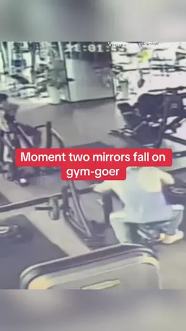 This is the moment a wall-mounted gym mirror detaches and falls directly onto a man working out, with a second bizarrely doing the same thing seconds later. #haunted #workout #Fitness #horror #health